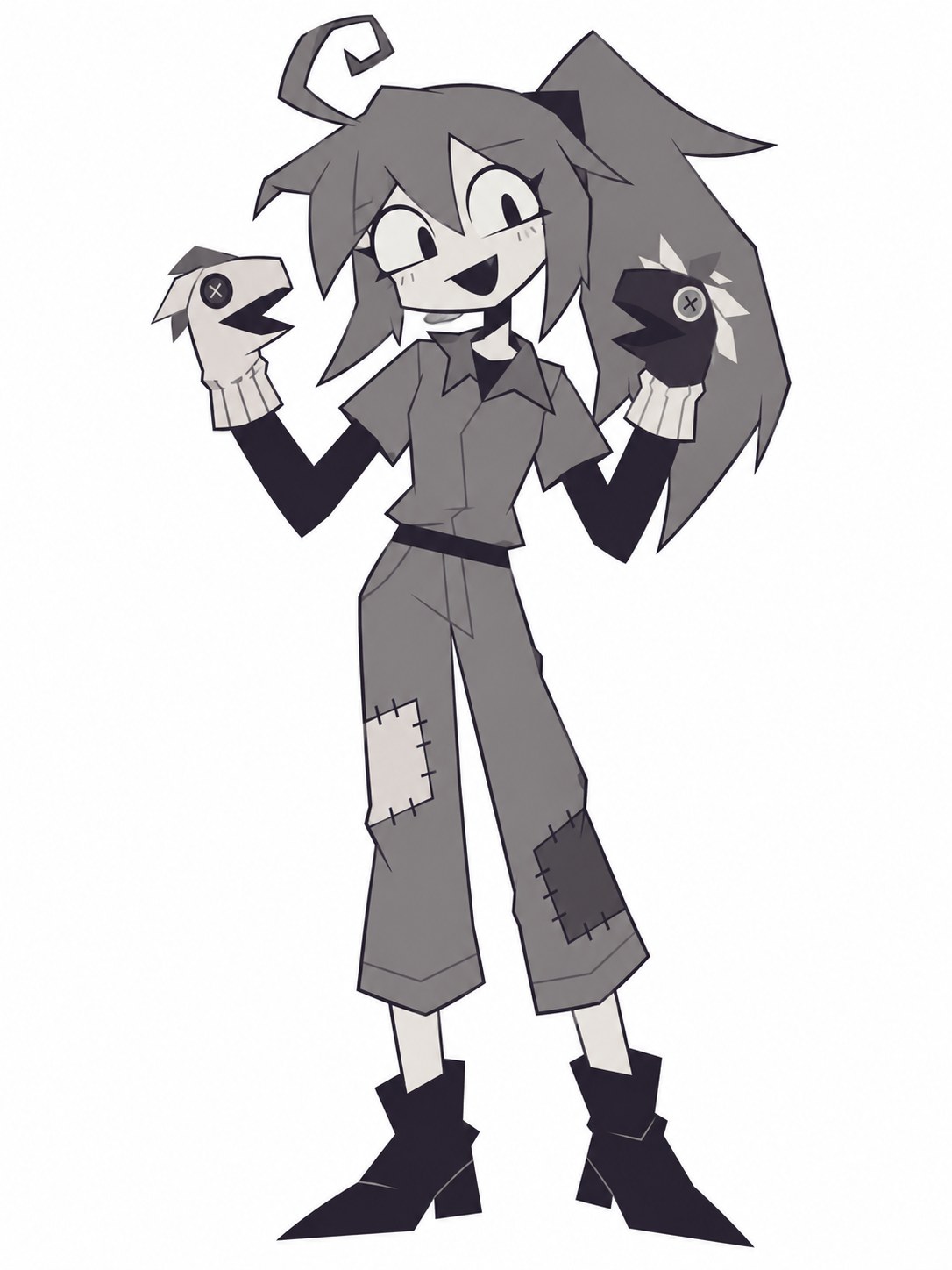 Lana smiling with a gray ponytail, two raised sock puppets, a gray shirt, patched trousers, and black ankle boots.